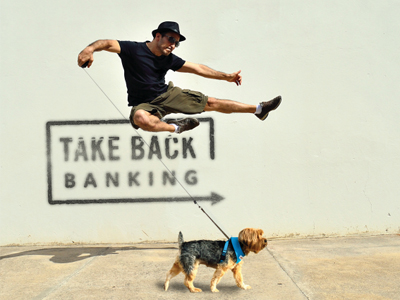 Image of a man jumping over dog because he used his Kasasa Cash Back checking account